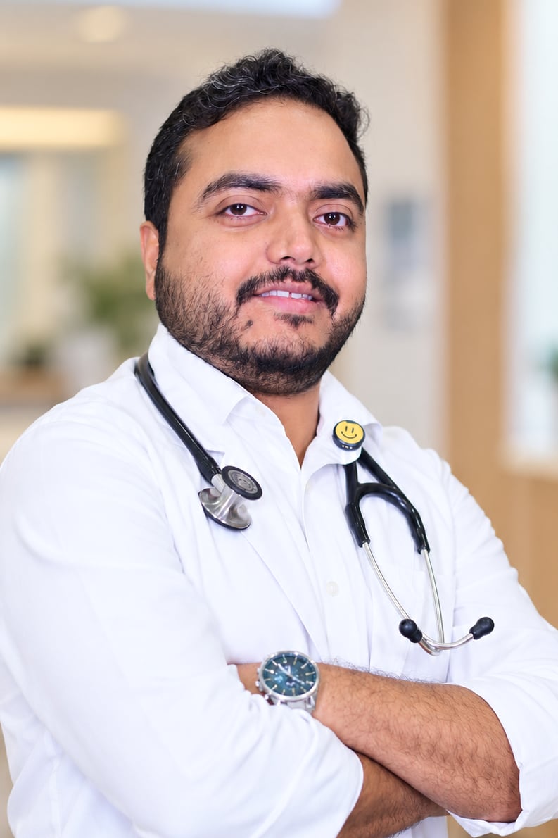 Dr. Tamoghna Das, physician at Medcare Diabetes & Obesity Clinic, Bongaigaon, in a white coat with a stethoscope